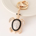 Exquise gouden schildpad sleutelhanger met glanzende strassteentjes en zwart emaille - Zwart