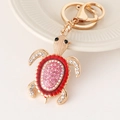 Porte-clés tortue dorée avec émail rouge et cristaux roses pour sacs à main - Rouge