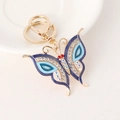 Blue butterfly keychain with golden metal finish and sparkling rhinestones for handbags - Blue