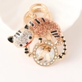 Portachiavi a forma di tigre dorata con strass champagne e grande gemma sfaccettata - Champagne