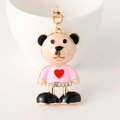 Portachiavi orsetto rosa e oro con maglione a cuore e strass brillanti decorativi - Rosa