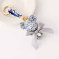 Sparkling blue rhinestone teddy bear keychain with gold crown and letter C pendant - Multicolor Blue Glow