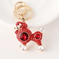 Sparkly red rhinestone poodle keychain with golden metal clasp and faceted crystal body - Red