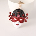 Portachiavi maschera veneziana con smalto nero, strass rossi e chiusura a moschettone - Rosso