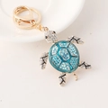 Turtle keychain in gold alloy with blue enamel shell and sparkling crystals - Blue