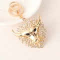 Golden cow head keychain with sparkling rhinestones and lobster clasp attachment - White