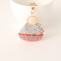 Porte-clés sac à main en strass rose avec fleurs dorées et fermoir mousqueton - Rose