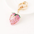 Pink strawberry keychain with sparkling crystals and gold-plated metal clasp - Pink