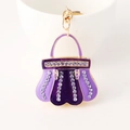 Elegante portachiavi a borsa in smalto viola con strass brillanti e finitura dorata - Viola