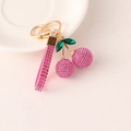 Pink rhinestone cherry keychain with golden hardware and matching glittery hand strap - Rose Red