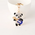 Sparkling panda guitar keychain featuring white rhinestones and gold metal lobster clasp - Blue