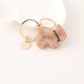 Pink rhinestone encrusted Scottish Terrier dog keychain with gold-tone hardware on white tray - Champagne