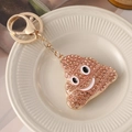Glittering brown rhinestone poop emoji keychain with gold lobster clasp and ring - Champagne