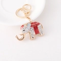 Llavero de elefante dorado con pedrería blanca y esmalte rojo en bandeja de cerámica - Rojo