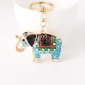 Golden elephant keychain with blue rhinestones and colorful enamel patterns - Blue