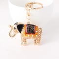 Golden elephant keychain with champagne crystals and colorful enamel patterns - Champagne