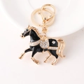 Portachiavi a forma di cavallo dorato con smalto nero e cristalli bianchi lucidi - Nero