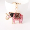 Pink rhinestone elephant keychain with golden alloy finish and lobster clasp detail - Pink