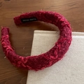 Detail of red tweed headband with handmade label and high-quality woven fabric texture - Red Fuzzy