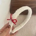 Detail view of a white plush headband with a red bow and a sparkling rhinestone - White Plush With Red Bowknot Hairband (9#)