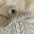 Close-up of soft faux fur texture on a light brown hair claw clip for autumn and winter - Milk Tea