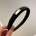 Detail of a black fabric headband with a sleek gold rectangular metal plate accent - Black Fabric Wrapped Square Crystal