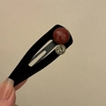 Detail of a black velvet teardrop hair clip with a red resin bead and faceted rhinestone - Large Red Bead Long Hair Clip