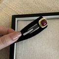 Macro detail of retro black matte BB hair clip with red gemstone and gold square border - Square Long Hair Clip