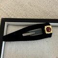 Detail of a red gemstone on golden base with black velvet flocking hair clip - Oval Long Hair Clip