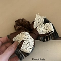 Close-up of brown bow hair claw featuring vintage lace and velvet texture details - White Lace Bow Hair Tie