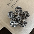Elegant pink tweed flower hair clip with black and white woven pattern on vintage book - Black and White Striped Flower Claw Clip