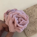 Detailed view of handmade pink chiffon rose flower hair claw clip held in hand - Large Flower Duckbill Clip / Light Pink