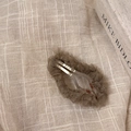 Detailed macro view of the ruched tulle BB hair clip in dark taupe with subtle shimmer - Coffee Oval