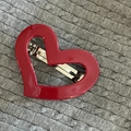 Detailed 45-degree view of a red heart spring hair clip with a glossy finish - #3 Red Heart Spring Clip