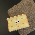 Detail of cute yellow cookie shaped hair claw with a funny cartoon facial expression - Yellow Square Cheese Hair Claw (3#)