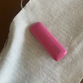 Glossy pink barrette hair clip with gold lettering on a white textured fabric base - Pink Square Hair Clip