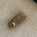 Detailed close-up of a tweed bow hair clip with colorful threads and gold bean accent - Pure Coffee White Dot Gold Label