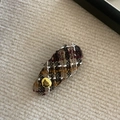 Close-up of vintage brown tweed plaid hair clip featuring a refined gold metal button - Milk Tea White Stripe Gold Label