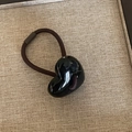 Close-up of a brown elastic hair tie featuring a glossy black heart-shaped pendant charm - Pure Black Heart Hair Tie (6#)