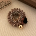 Handcrafted woven hair tie with black flower charm and shiny golden bead accessory - Khaki Coiled with Golden Bead