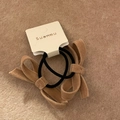 Detail of two-piece brown velvet bow hair ties on a textured display card - Milk Tea Bow Crossover Hair Ties (Set)