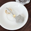 Portachiavi a stella con strass argento, cinturino bianco e anello in metallo dorato - Bianco