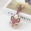 Pink rhinestone fox keychain pendant with white pearls on a gold-plated metal ring - Purple
