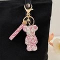 Sparkly pink rhinestone bear keychain with crystal hand strap on black canvas bag - Pink White