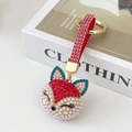 Charming fox keychain with white pearls, red rhinestones and a gold metal ring - Red