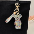 Colorful rhinestone bear keychain for handbags featuring sparkling crystal studs and gold hook - Rainbow