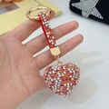 Fonkelende hartvormige sleutelhanger met kleurrijke strass en goudkleurige ring - Rood Wit