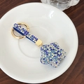 Porte-clés étoile orné de strass bleus et blancs avec sangle en tissu bleu pailleté - Bleu Blanc