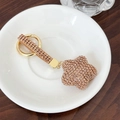 Porte-clés étoile en or champagne avec strass scintillants et fermoir mousqueton chic - Champagne