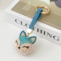 Blue fox keychain with sparkling rhinestones, faux pearls, and a blue leather strap - Blue